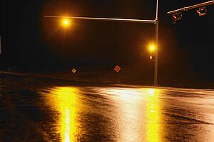 Yellow light at intersection at night