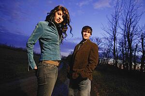 Young trendy man and woman outside