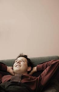Man relaxing on sofa