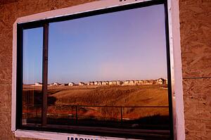 Reflection of landscape in window