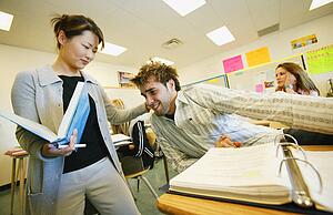 Teacher pulling students ear