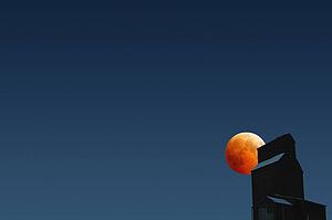 Silhouette of building against dark sky
