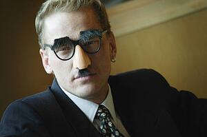 Businessman wearing Groucho Marx disguise