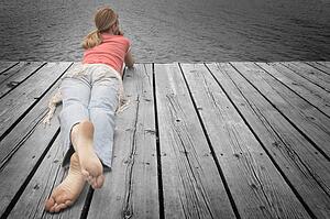 Girl laying on decking