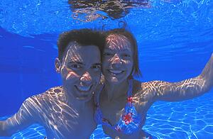 Young couple in swimming pool