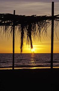 Sun setting on water