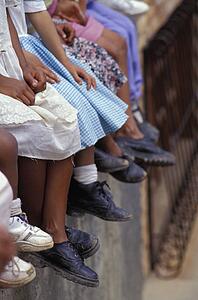 Row of native children and their shoes