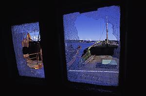 Broken-down boat with shattered windows