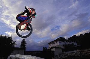 Unicyclist taking a jump