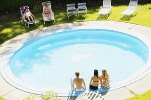 Teens sitting at a pool