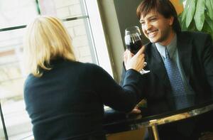 Young professional couple drinking wine