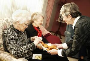 Elderly women having cookies