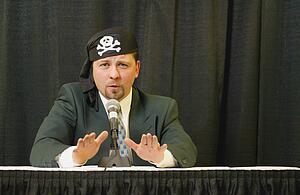Speaker wearing pirate headgear