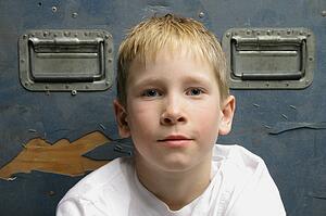 Close-up of young blonde boy