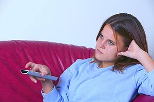 Teen with TV remote