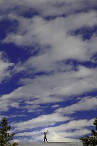 Man pointing up to sky
