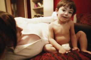 Child sitting on bed