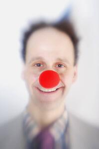 Man wearing clown's nose
