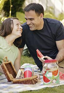 Adult couple having a picnic