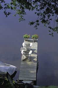 Two outdoor chairs on the deck