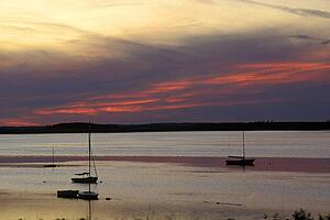 Sunset over large expanse of water