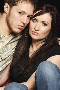 Couple sitting close together