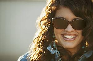 Attractive woman modeling trendy sunglasses