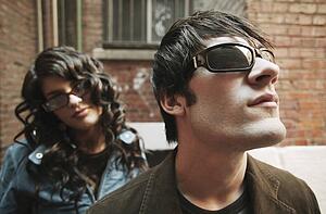 Trendy couple wearing sunglasses