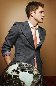 Young man with globe