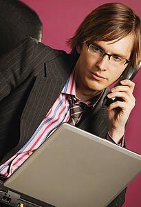 Businessman with phone and lap top