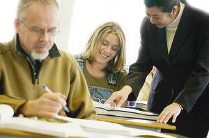 Adult students with teacher