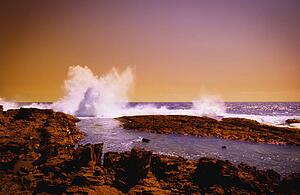 Wave crashing on rocks