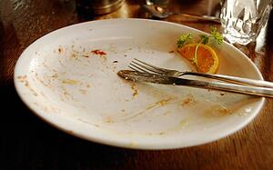 Plate with utensils and garnish on it
