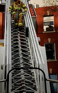 Fireman coming down ladder