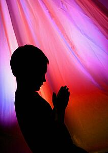 Young boy praying