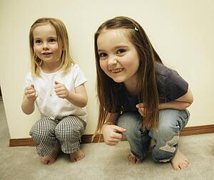 Two small girls playing