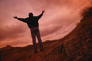 Man with arms raised