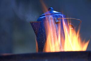 Camping kettle over fire