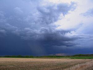 Dark clouds over field