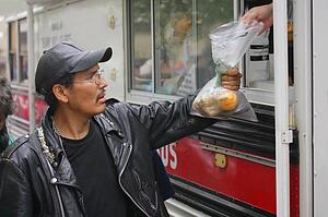Food being given to a man