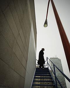 A businessman ascending a stairway