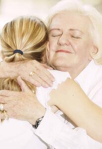 Grandma hugging granddaughter