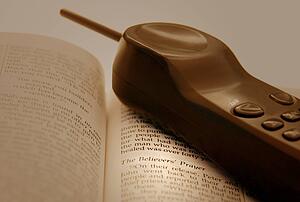 Cell phone and an open Bible