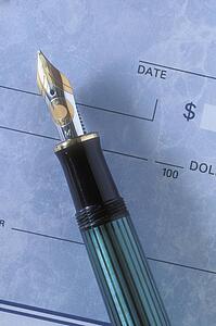 Close up of a fountain pen and cheque