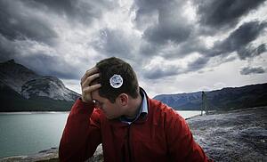 Man with compass graphic on head