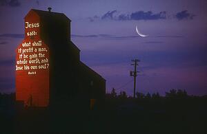 A biblical message on the side of a grain elevator, Nisku, Alberta, Canada