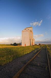 Grain elevator along side of railway tracks
