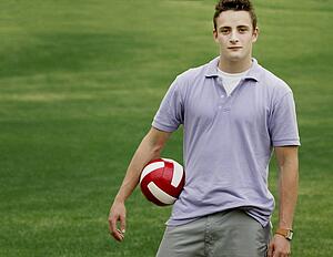 Young man holding a football