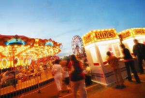 A carousel and ticket booth at an amusement park