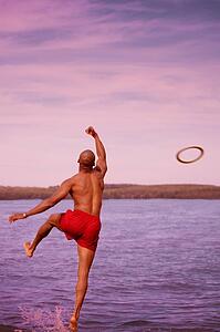 Man throws a swim ring